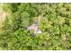 An overhead view shows a property with a pool, nestled in a dense canopy of trees at 4933 Round Lake Rd, Apopka, FL 32712