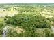A large plot of heavily treed land has a blue location marker for future development at 4933 Round Lake Rd, Apopka, FL 32712