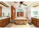 A stone bathtub and and sinks highlight this bathroom at 4933 Round Lake Rd, Apopka, FL 32712