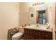 Small bathroom with sink, toilet, and floral wallpaper at 4933 Round Lake Rd, Apopka, FL 32712