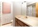 A very small bathroom with a sink, mirror, and a toilet at 4933 Round Lake Rd, Apopka, FL 32712