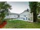 Backyard featuring a patio with barbeque grill, bird bath, and a privacy lattice at 50989 Highway 27 # 176177, Davenport, FL 33897
