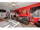 Star Wars themed bedroom featuring a modern black leather couch and a ceiling fan at 50989 Highway 27 # 176177, Davenport, FL 33897