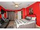 Spacious bedroom featuring a modern black leather couch, a Star Wars poster, and black curtains at 50989 Highway 27 # 176177, Davenport, FL 33897