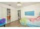 Comfortable bedroom showing closet doors and adjoining rooms, with fun decor at 50989 Highway 27 # 176177, Davenport, FL 33897