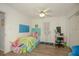 Bright and airy bedroom with a ceiling fan, closet, and a mix of fun decor at 50989 Highway 27 # 176177, Davenport, FL 33897