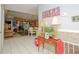 Entryway with tile floors, decorative table, and view into adjacent rooms at 50989 Highway 27 # 176177, Davenport, FL 33897