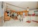 Bright living room with open layout, tile flooring, and views of the kitchen and sliding glass doors at 50989 Highway 27 # 176177, Davenport, FL 33897