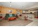 Comfortable living area with tile and wood laminate flooring, flowing into the bright kitchen at 50989 Highway 27 # 176177, Davenport, FL 33897