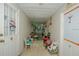 Enclosed porch with tiled floor and lots of seating for relaxing at 50989 Highway 27 # 176177, Davenport, FL 33897