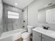 Bathroom featuring a tiled shower and tub, a toilet, and a vanity at 514 S Cottage Hill Rd, Orlando, FL 32805