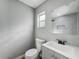 Bright bathroom with gray walls, a modern vanity, and updated fixtures at 514 S Cottage Hill Rd, Orlando, FL 32805