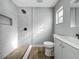 Modern bathroom features stylish gray tiles, a shower, and updated fixtures at 514 S Cottage Hill Rd, Orlando, FL 32805