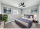 Bedroom with a queen bed, ceiling fan, two windows, and two night stands at 514 S Cottage Hill Rd, Orlando, FL 32805
