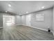 Bedroom featuring wood floors, white walls, window with blinds, and a white door at 514 S Cottage Hill Rd, Orlando, FL 32805