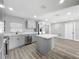 Bright, open kitchen features stainless steel appliances, shaker cabinets, and center island at 514 S Cottage Hill Rd, Orlando, FL 32805