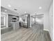 Open-concept kitchen featuring stainless steel appliances, shaker cabinets, and center island at 514 S Cottage Hill Rd, Orlando, FL 32805