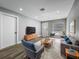 Bright living room features modern flooring, stylish furnishings, and ample natural light at 514 S Cottage Hill Rd, Orlando, FL 32805
