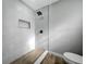 Modern walk-in shower with grey tile, rain shower head, and niche at 514 S Cottage Hill Rd, Orlando, FL 32805