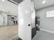 Utility room featuring a water heater, easy access to the kitchen and exterior at 514 S Cottage Hill Rd, Orlando, FL 32805
