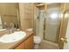 Bathroom featuring glass shower, faucet, toilet, and shelves for storage at 519 Beasley Ct, Orlando, FL 32807