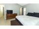 Bedroom featuring a gray wall, a bed, and a dark wooden dresser at 519 Beasley Ct, Orlando, FL 32807