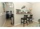 Breakfast bar area in open plan kitchen and dining area at 519 Beasley Ct, Orlando, FL 32807