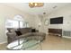 Open living room with a large window, tile floors, and neutral-colored walls at 519 Beasley Ct, Orlando, FL 32807