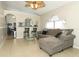 Bright and spacious living room featuring a modern ceiling fan and tile floors at 519 Beasley Ct, Orlando, FL 32807