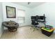 Office space featuring a desk with monitors, a comfortable chair, and a storage bin at 519 Beasley Ct, Orlando, FL 32807