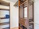 Walk-in closet with wood shelving units and ample storage space at 5311 Saddleback Ct, Lady Lake, FL 32159