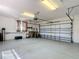 Spacious garage with epoxy flooring and a new garage door at 5311 Saddleback Ct, Lady Lake, FL 32159