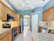 Gourmet kitchen with stainless appliances, granite counters, and stylish backsplash at 5311 Saddleback Ct, Lady Lake, FL 32159