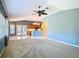Open concept living room and kitchen with vaulted ceilings and plenty of natural light at 5311 Saddleback Ct, Lady Lake, FL 32159