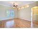 Spacious living room boasts wood floors, recessed lighting, and an open layout perfect for relaxation and entertaining at 5311 Saddleback Ct, Lady Lake, FL 32159