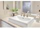 Bathroom with a modern sink, vanity, and a decorative mirror creating a bright and inviting space at 563 Midway Trak # K102, Ocala, FL 34472