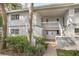 Exterior view of an apartment building with well-maintained landscaping at 563 Midway Trak # K102, Ocala, FL 34472