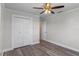 Neutral bedroom featuring ceiling fan and closet at 588 Highway 630 E, Frostproof, FL 33843