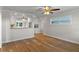 Bright dining room with an opening to the kitchen and new, wood-look floors at 588 Highway 630 E, Frostproof, FL 33843