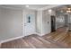 View of the entryway and open access to kitchen, featuring stainless steel refrigerator at 588 Highway 630 E, Frostproof, FL 33843
