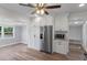 Modern kitchen with stainless steel refrigerator and microwave and ample storage at 588 Highway 630 E, Frostproof, FL 33843
