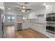Open-concept kitchen with a stainless dishwasher, ample cabinets, and sleek appliances at 588 Highway 630 E, Frostproof, FL 33843