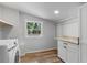 Functional laundry room with modern washer and granite countertop at 588 Highway 630 E, Frostproof, FL 33843
