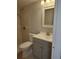 Bathroom featuring tiled shower, a toilet and a vanity sink at 6108 Curry Ford Rd # 116, Orlando, FL 32822