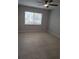 Bedroom featuring tiled flooring, a ceiling fan and a window allowing natural light at 6108 Curry Ford Rd # 116, Orlando, FL 32822