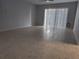 Spacious living room with tiled flooring and sliding glass doors allowing natural light at 6108 Curry Ford Rd # 116, Orlando, FL 32822