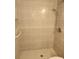 A tiled shower with grab bar is easily accessible and provides modern fixtures at 6108 Curry Ford Rd # 116, Orlando, FL 32822
