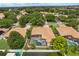 Bird's eye view of residential area featuring tile-roofed homes, screened pools, and verdant trees at 6426 Montclair Bluff Ln, Windermere, FL 34786