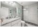 Modern bathroom with a granite vanity, tiled shower, and stylish fixtures at 6426 Montclair Bluff Ln, Windermere, FL 34786