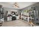 Spacious bedroom with ceiling fan and natural light, creatively decorated with various collectibles at 6426 Montclair Bluff Ln, Windermere, FL 34786